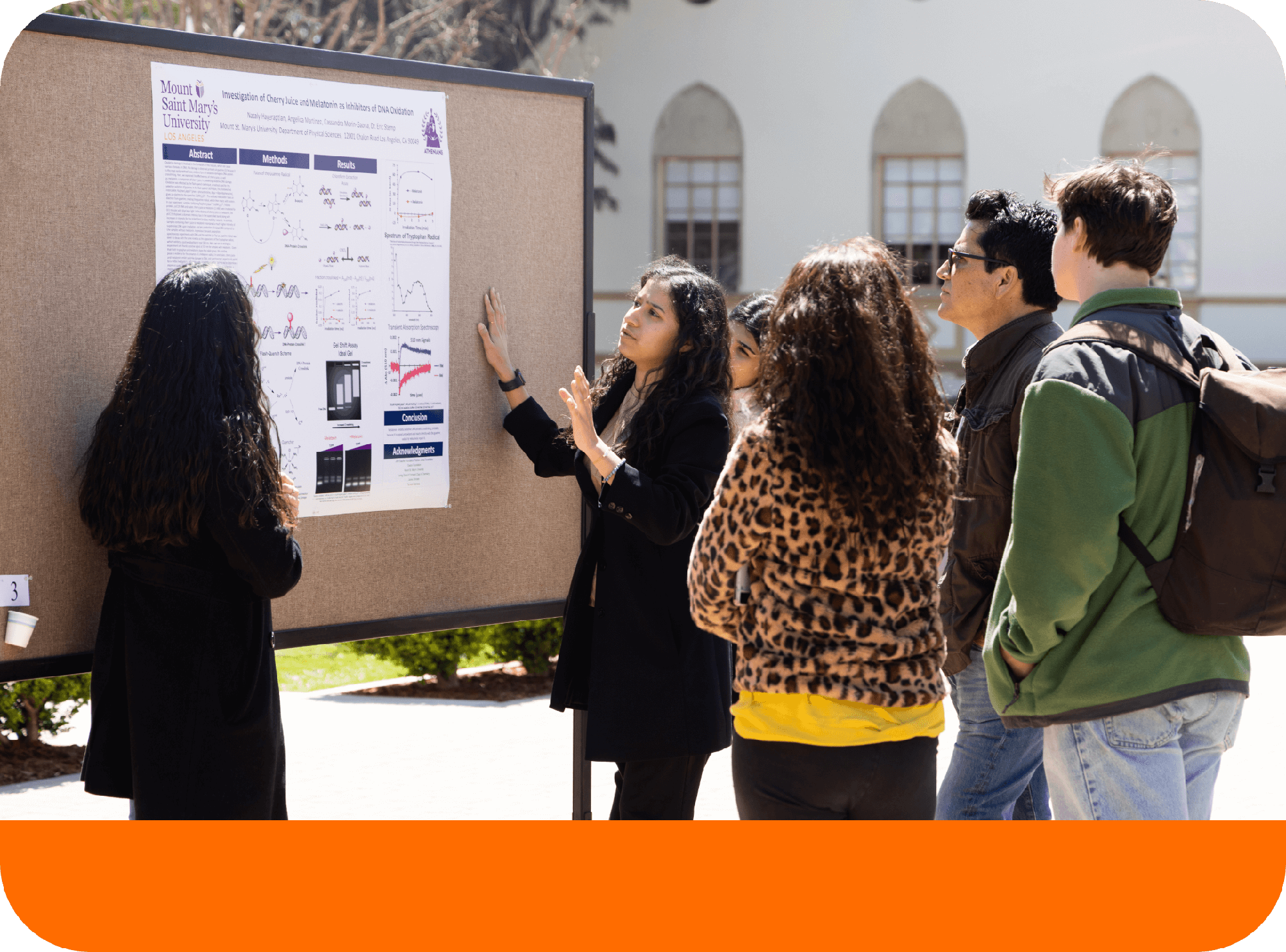 Students giving a presentation outdoors.