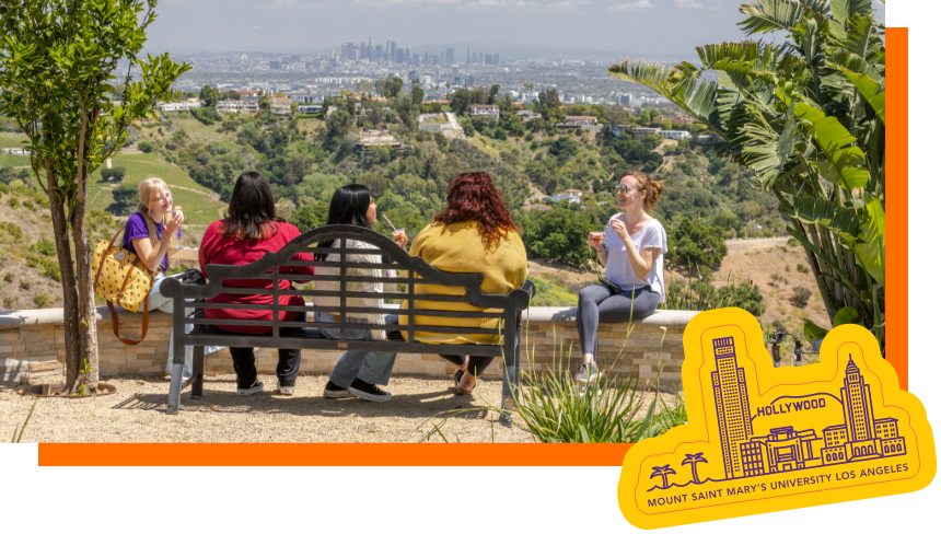 Students on a bench overlooking LA.