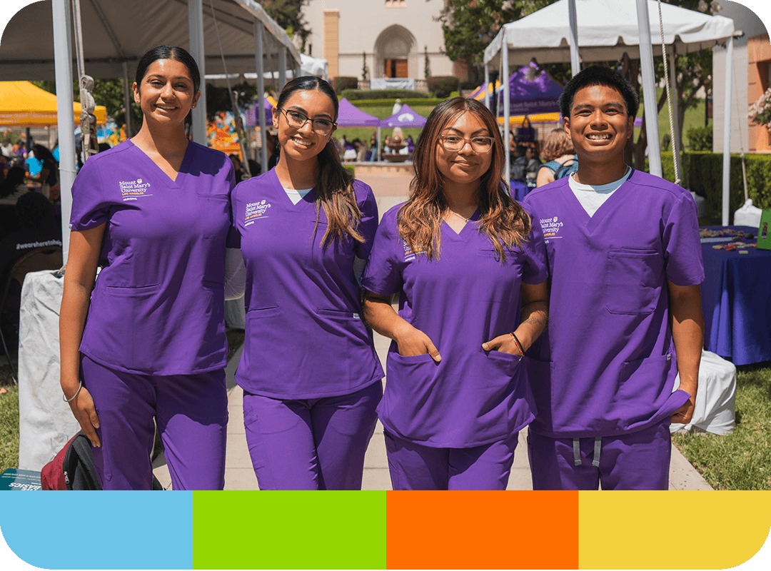Students wearing MSMU scrubs smiling at camera.
