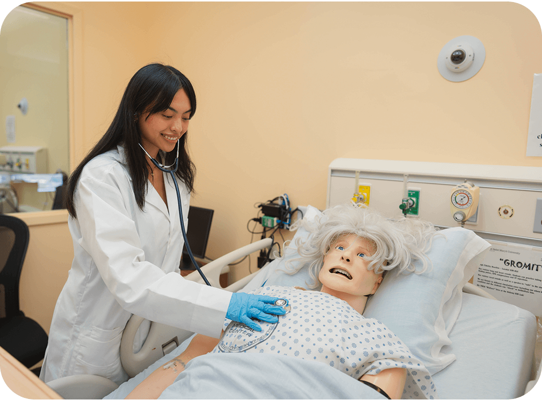 Student working in a nursing simulation lab.